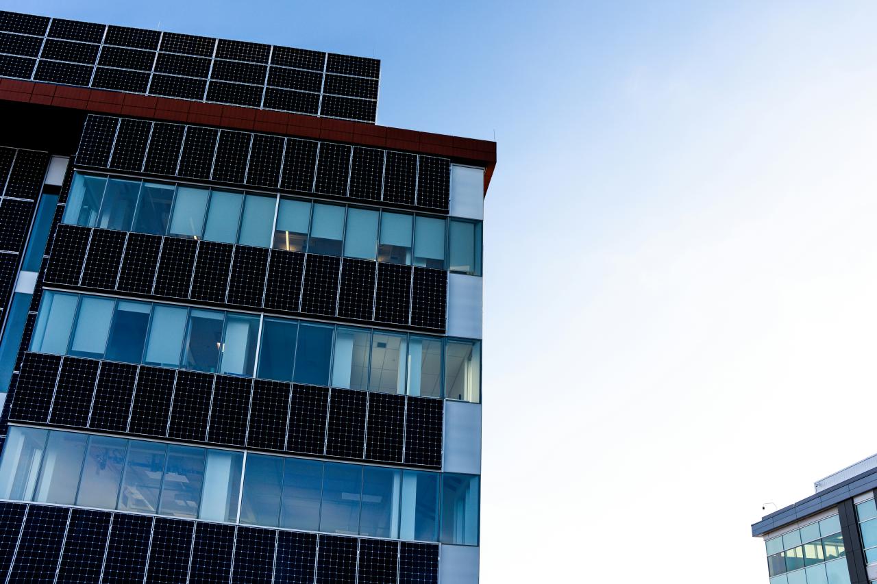 Modern building facade covered in solar panels
